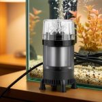 Compact submersible aquarium pump with magnetic drive motor and rubber mounting feet for silent operation in bedroom fish tank